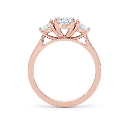 Oval and trilliant cut diamond trilogy ring