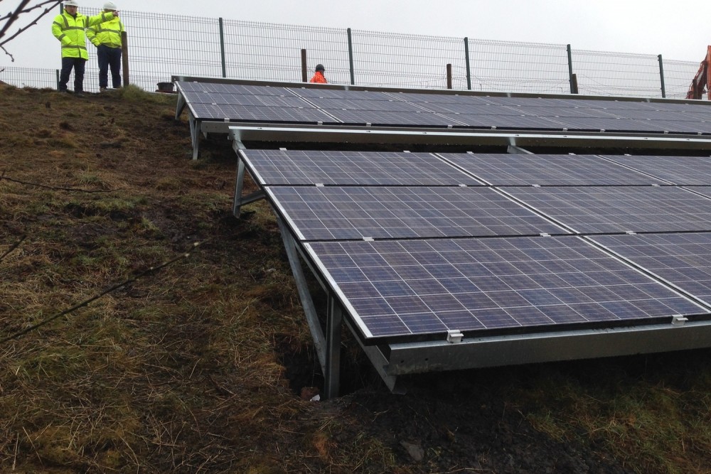 Secure fixing for ground mounted solar panels