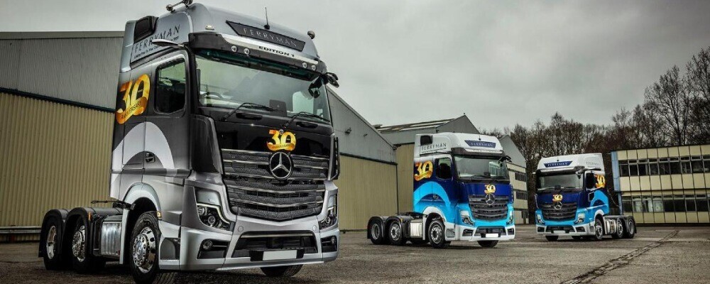UK lorry cabs wrapped with vinyl liveries and graphics following branding compliance and regulations.
