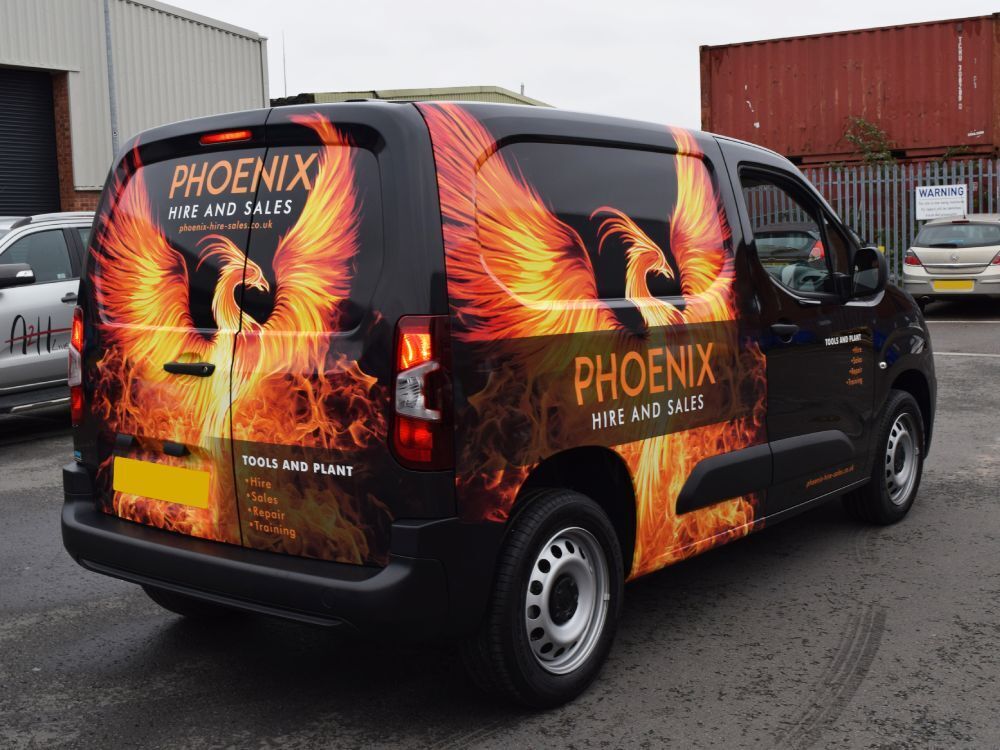 Company branded full wrap with flame design on a Citroen Berlingo van.