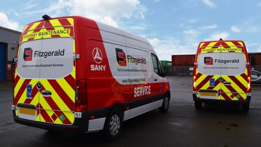 Two Mercedes company vans with matching branded vehicle wraps and rear high visibility reflective safety chevron graphics.