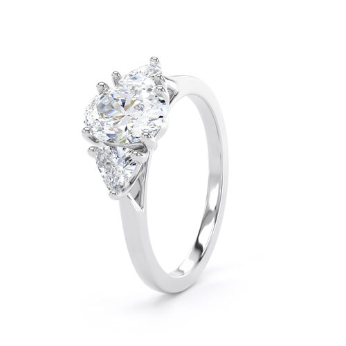 Oval and trilliant cut diamond trilogy ring