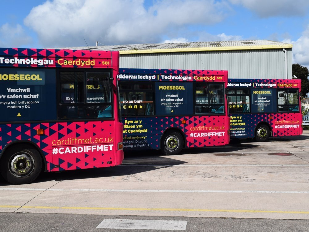 Cardiff Bus fleet with newly installed branded vehicle wraps and graphics.