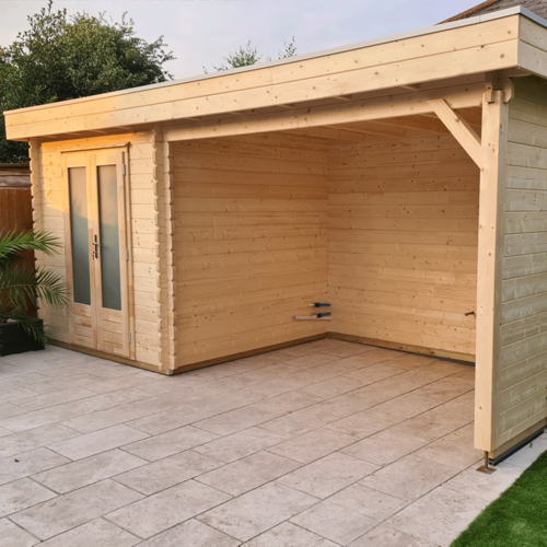 A bespoke garden gazebo supplied by Lugarde and designed and installed by Forevertimber. This structure features a natural timber finish, combining an enclosed storage area with double glass-panelled doors and an open-sided section for versatile use. The flat roof and sturdy wooden support beams with decorative bracing add to the modern yet rustic aesthetic. The gazebo is built on a spacious stone-tiled base, providing a clean and durable surface suitable for outdoor seating, dining, or storage. Its simple yet functional design blends seamlessly into a garden or patio setting, offering practicality and style.