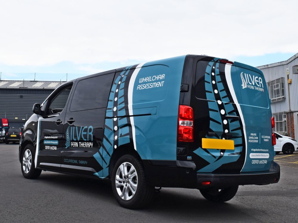 Partial company branded van livery and graphics on Vauxhall Vivaro.