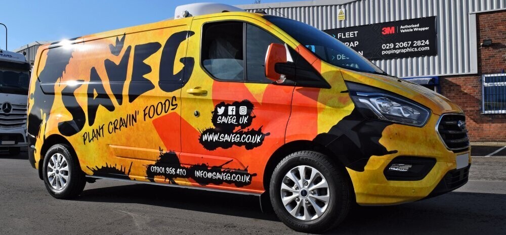 Bold and attractive yellow and black branded full vehicle wrap on a company van.