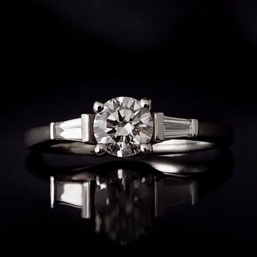 Round diamond and tapered baguette trilogy ring