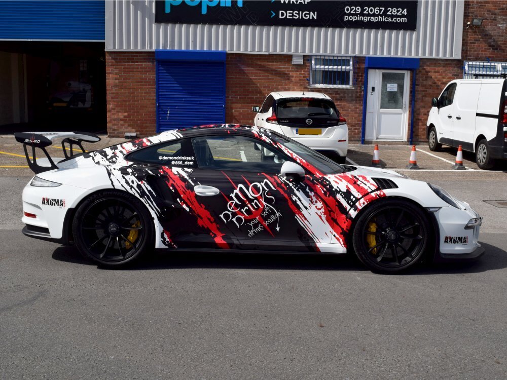 Cool motorsport wrap and race car graphics on a white Porsche GT3 RS