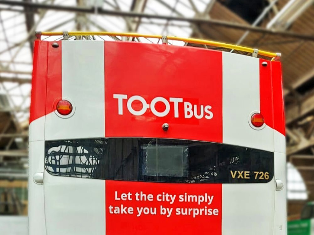 Union Jack livery and Tootbus London branded vehicle graphics on Optare VXE open top tour bus.