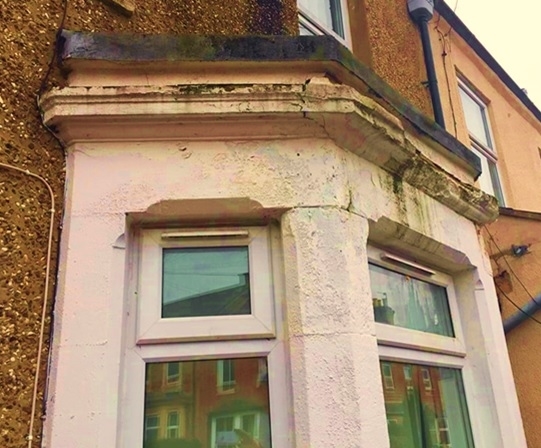 Building Defect Analysis: Structural damage to stone columns in a bay window of a Victorian house