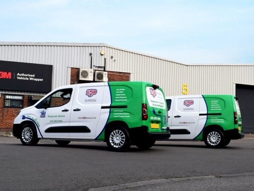 Fleet of company electric vehicles with new liveries and vinyl graphics outside Popin wrap centre in Cardiff.