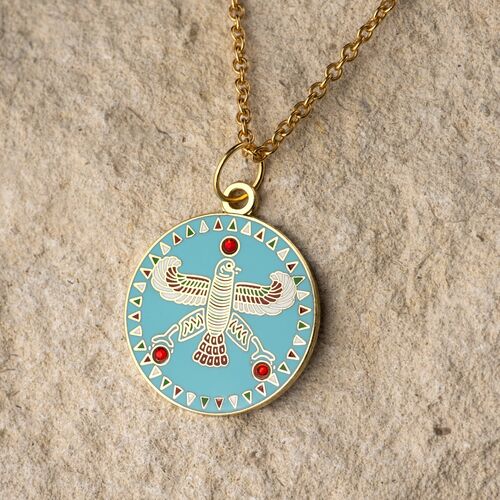Round Pendant. The Persian Falcon.  Blue Turquoise with 3 Red Stones.