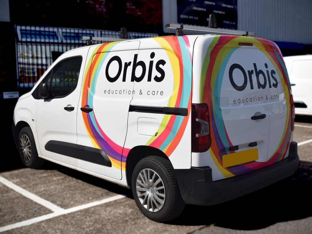 Partial wrap with branded design on a white Citroen Berlingo company van.