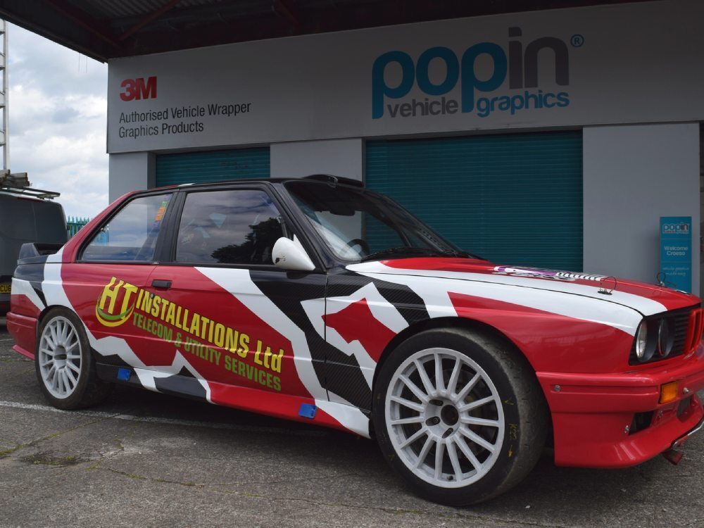 Race car wrap and graphics on a BMW E30