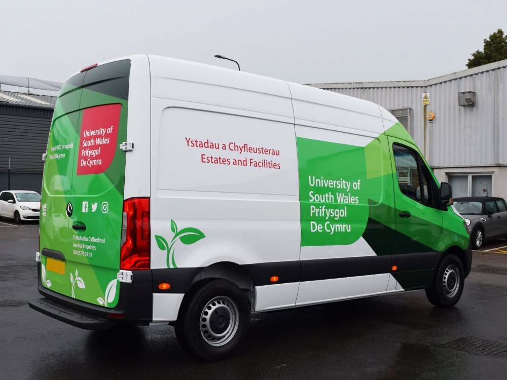 University of South Wales branded partial wrap and vehicle graphics on Mercedes-Benz eSprinter electric van.