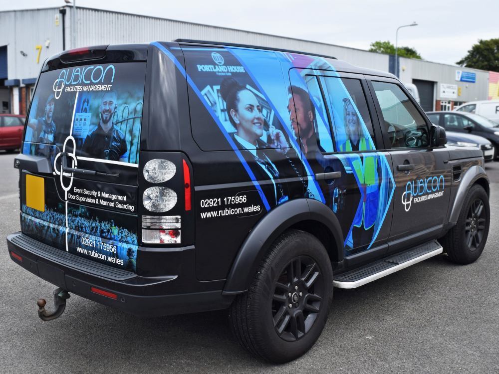 Branded vehicle wrap on a company Land Rover Discovery.