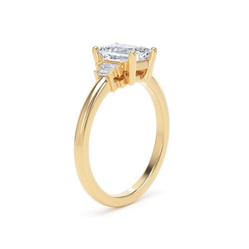 Emerald cut solitaire with stepped baguette cut diamond shoulders