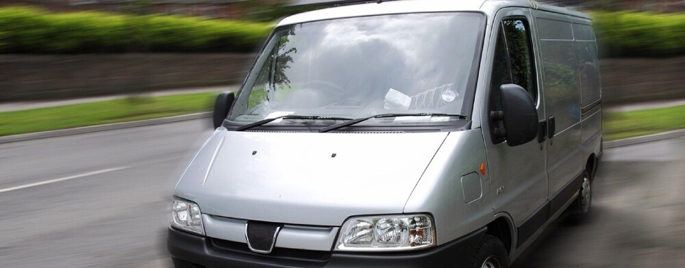 Leased silver van post-wrap removal, showing clean factory paint.