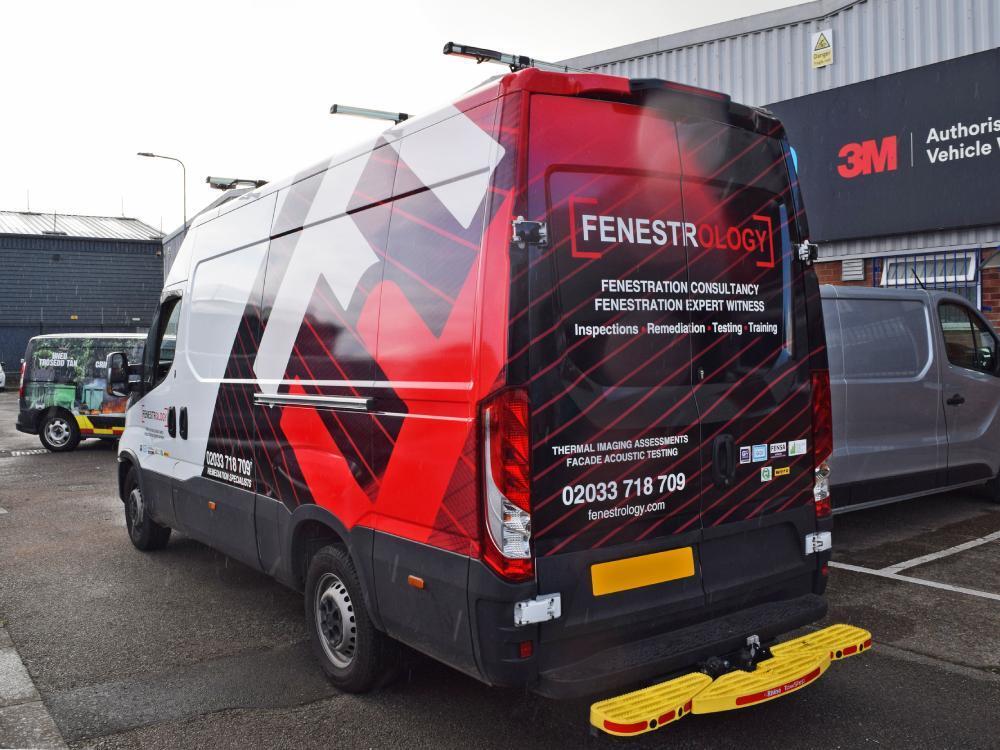 Company branded vehicle wrap on rear end of Iveco Daily van.