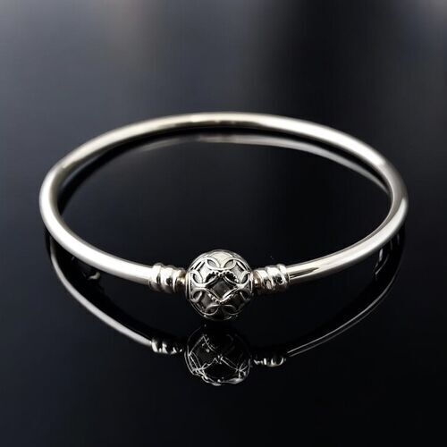 Silver stacking bangle with orb clasp