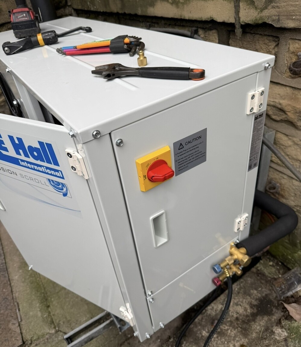 Commercial air conditioning maintenance engineer servicing HVAC equipment in Preston Lancashire.