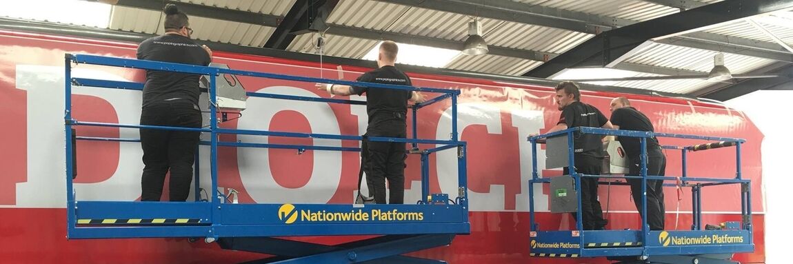 Vehicle graphic being installed onto a lorry by Popin Graphics