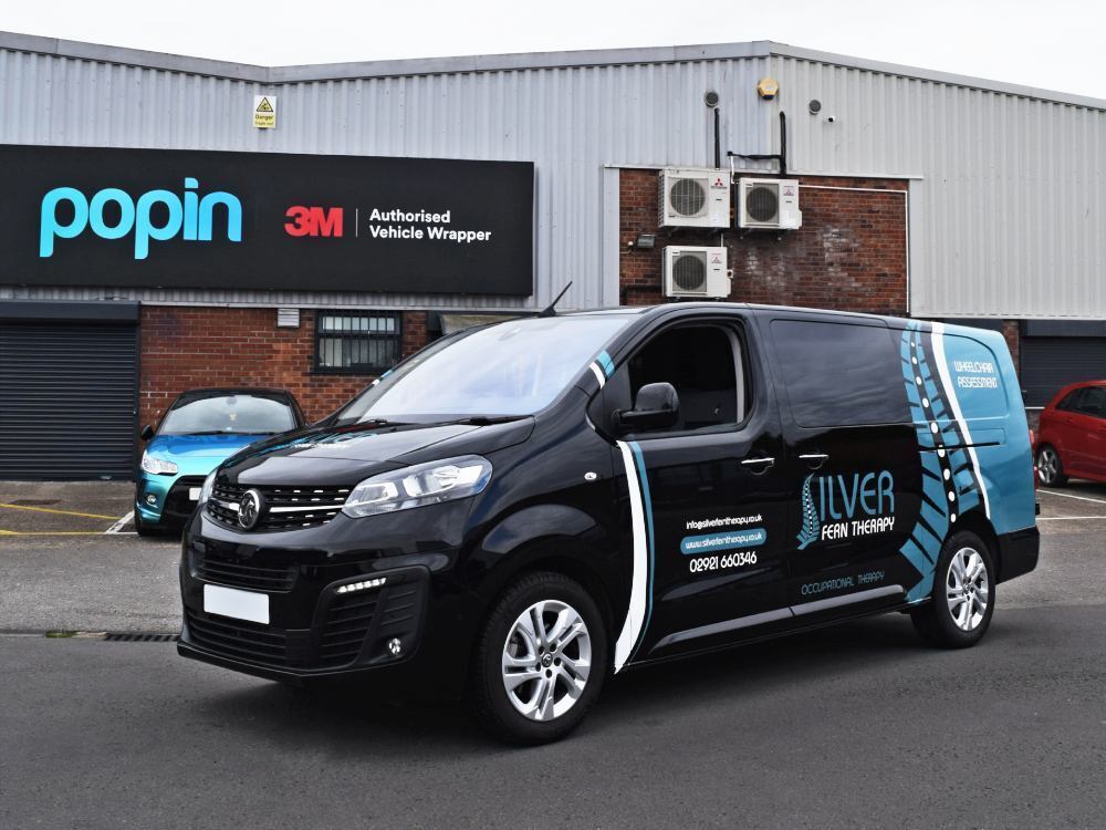 Partial van livery on company Vauxhall Vivaro vehicle outside Popin wrap facilities in Cardiff.