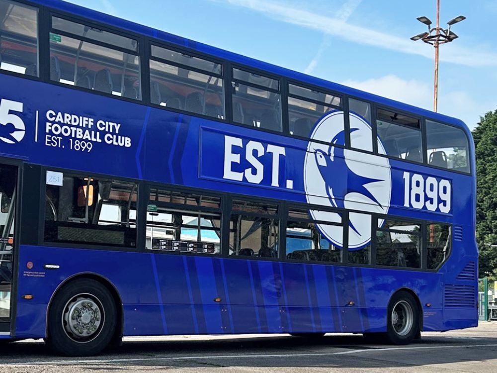 Blue and white Cardiff City FC livery on Alexander Dennis Enviro 400 bus.