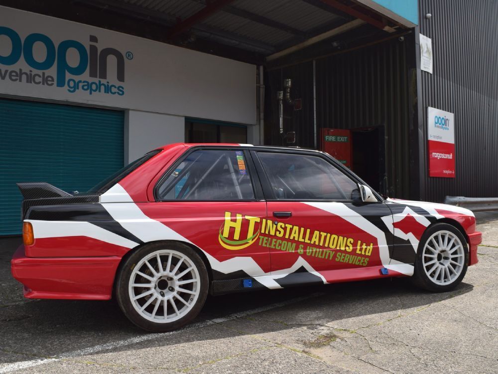 Motorsport livery and decals on a BMW E30 race car