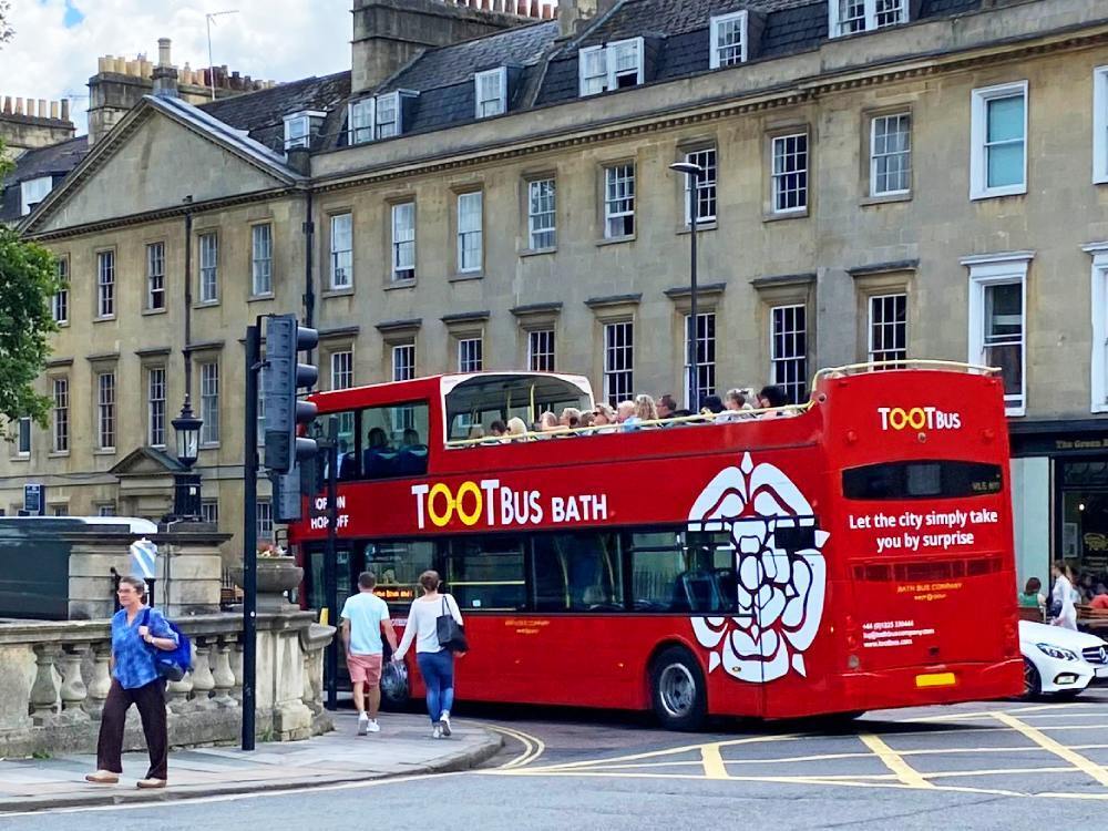 Red Optare VLE open top bus with Tootbus Bath branded vinyl graphics.