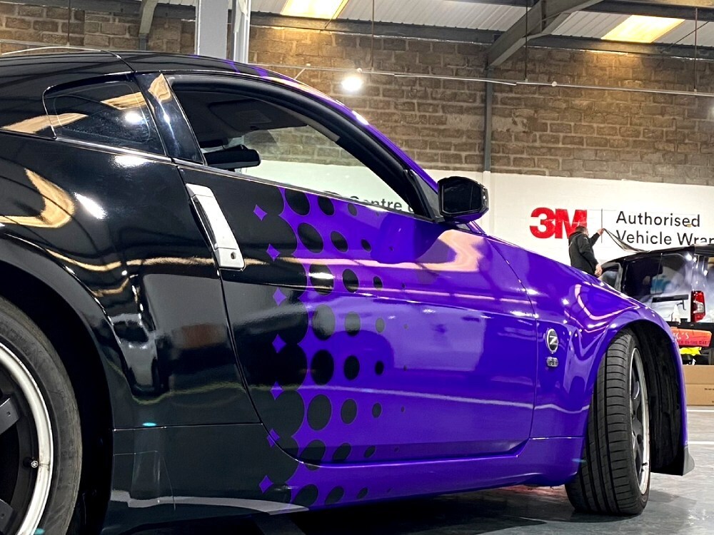 Vibrant purple wrap and graphics on Nissan 350Z sports model car