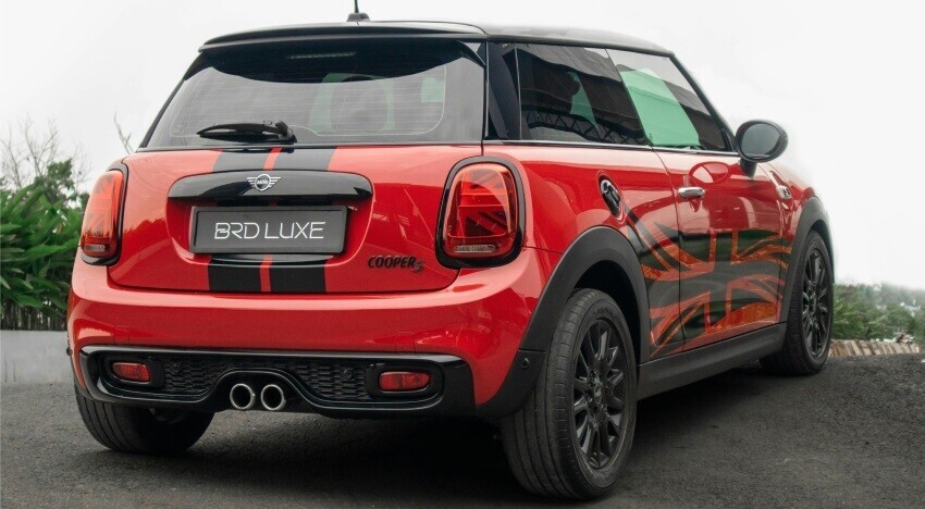 Red Mini Cooper S with red motorsport wrap and black vinyl graphics