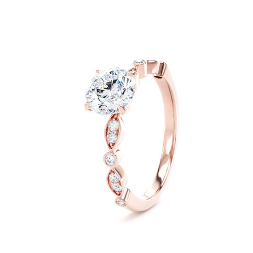 Round brilliant solitaire with fancy shaped shoulders