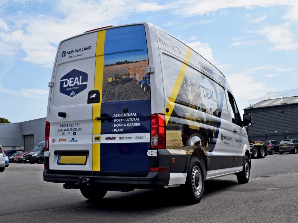 Rear of MAN TGE company van with branded vehicle livery.
