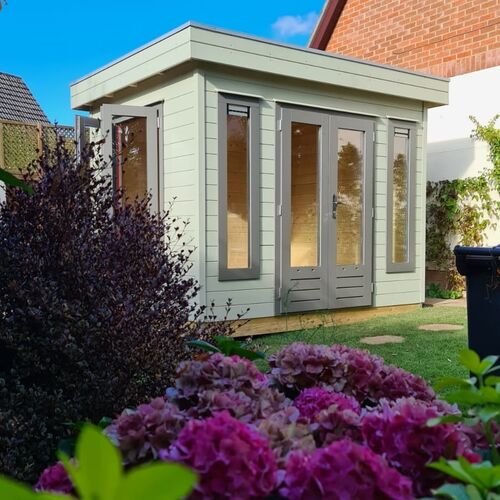 A fully painted bespoke garden room in a beautiful setting