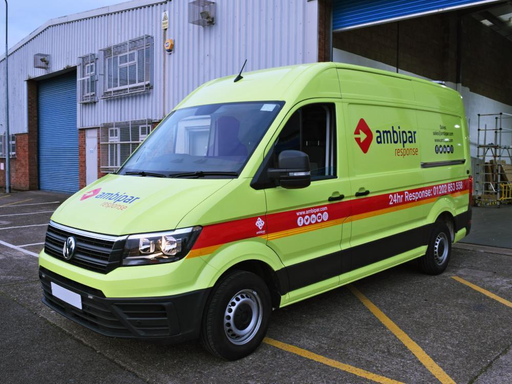 Volkswagen Crafter with bright yellow Ambipar Response van wrap.
