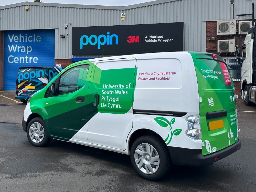 Nissan e-NV200 electric van with University of South Wales vehicle livery and graphics outside Popin in Cardiff.