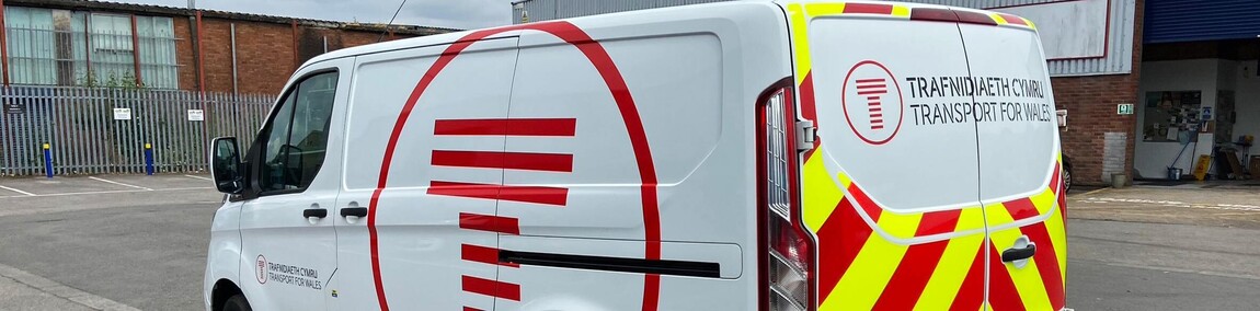 High conspicuity reflective chevron markings on rear of Transport for Wales work van.