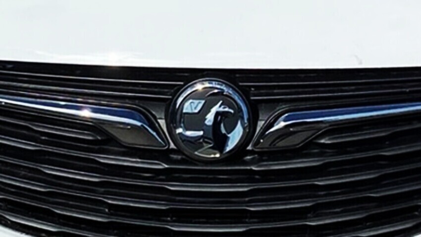 Vauxhall emblem on the front of a white van.