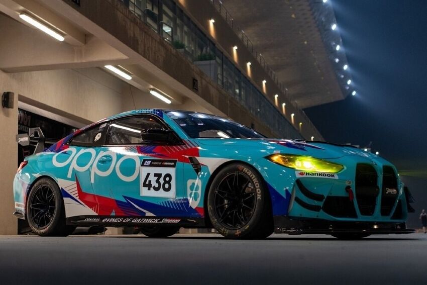 Race car with motorsport livery at night