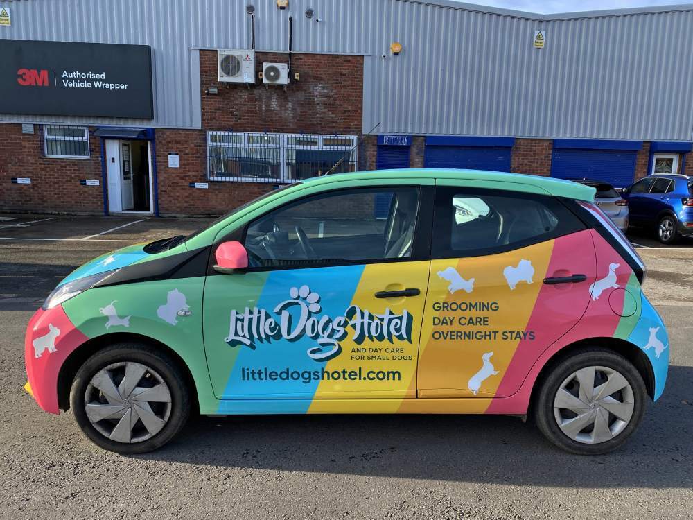 Colourful full vehicle wrap on Toyota Aygo company car.