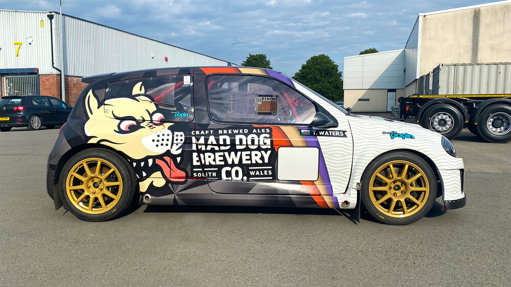 Renault Clio V6 with bespoke vehicle wrap branding for Mad Dog Brewery Co