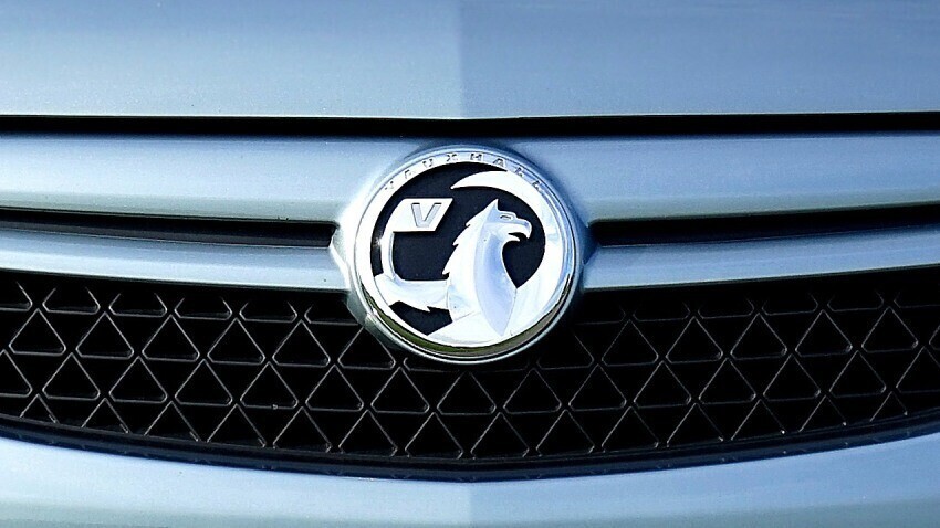 Vauxhall vehicle badge on front of company car.