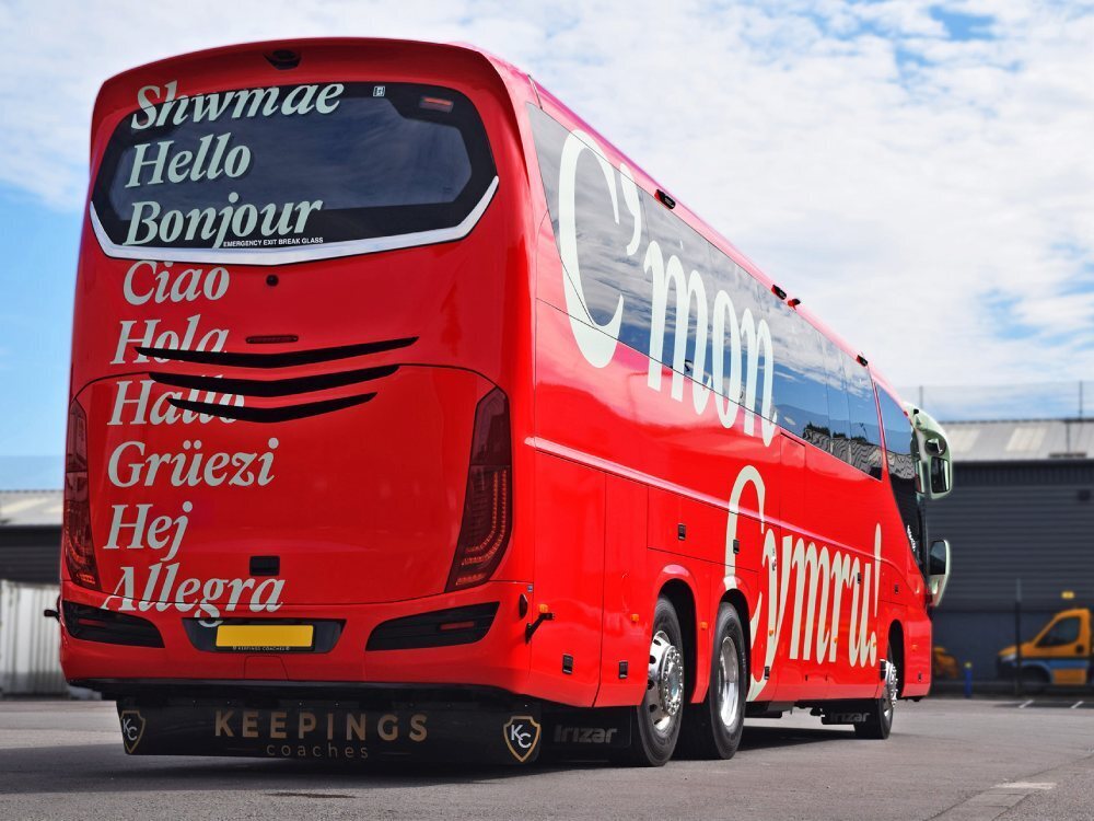 Red FAW branded livery and graphics on rear of Scania Irizar.