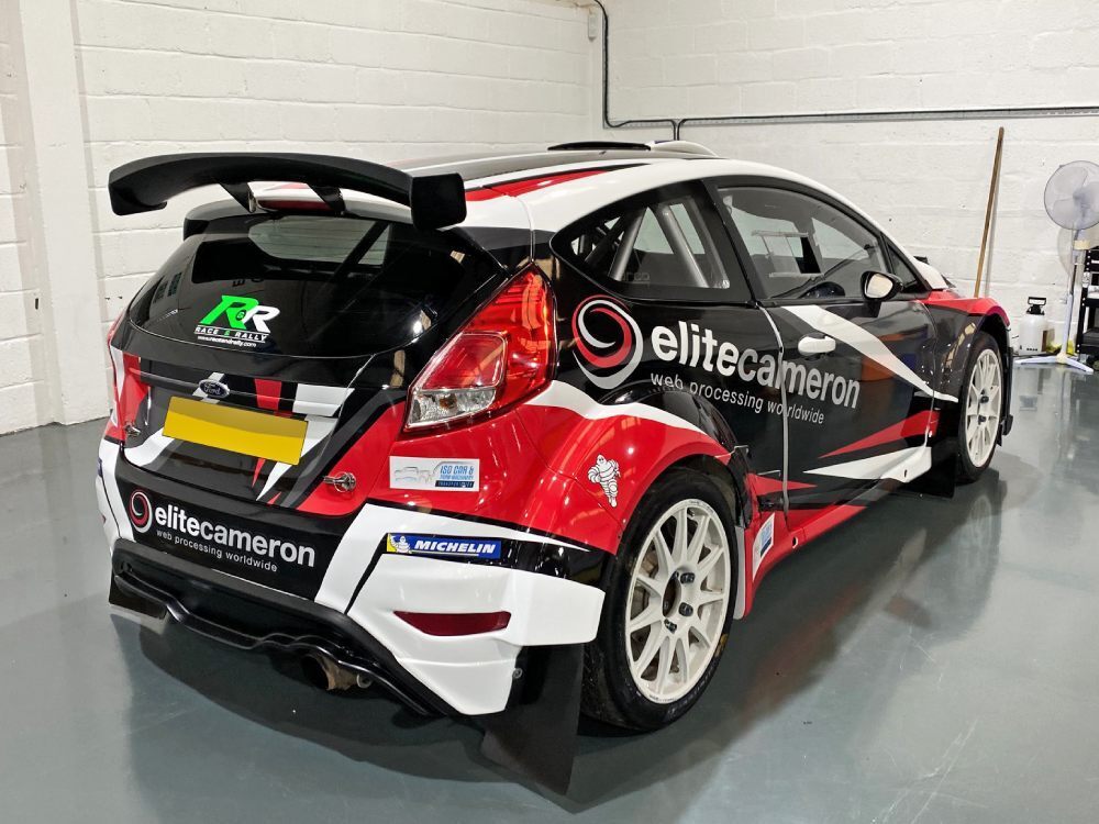 Rear of Ford Fiesta R5 with commercial wrap.
