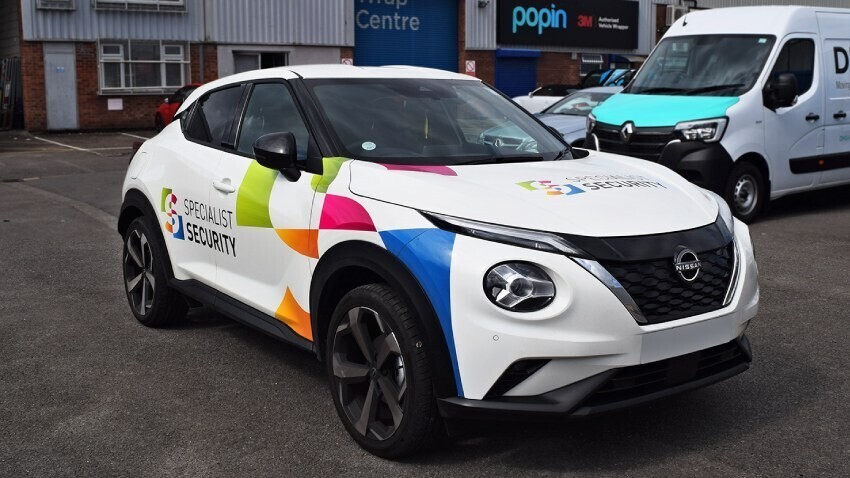 Nissan Juke company car with branded wrap and graphics outside Popin in Cardiff.