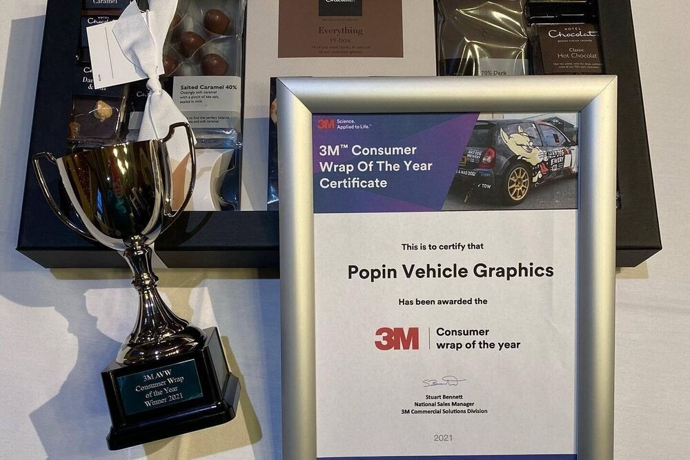 Trophy and framed award for Popin Graphics' 3M Consumer Wrap of the Year 2021 achievement