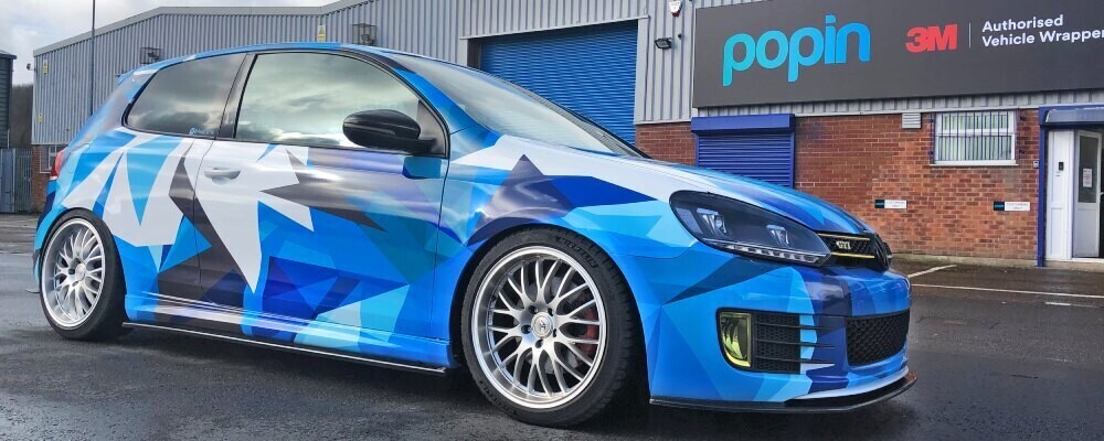 Volkswagen Golf GTI with cool and funky full blue vehicle wrap.