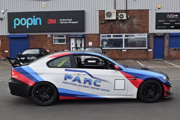 Company branded car wrap and graphics on a BMW M3 outside Popin in Cardiff.