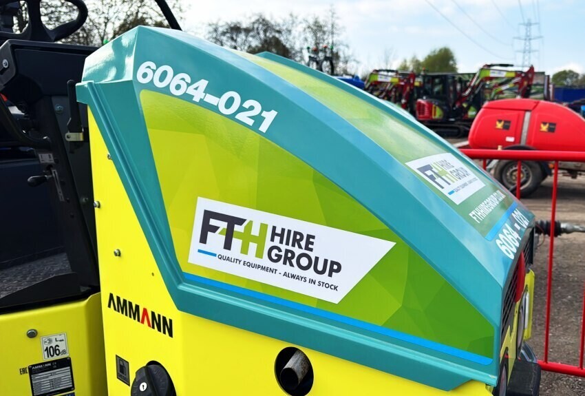 Branded vinyl graphics on a piece of plant machinery equipment.